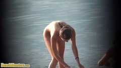 Slim blonde bathing naked in the sea Thumb